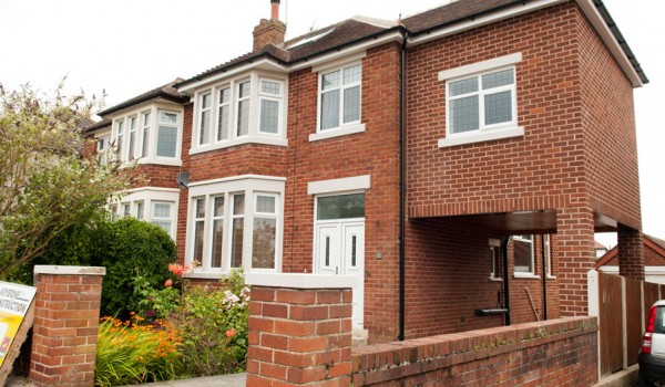 red bricked semi detached house with extension on the right hand side