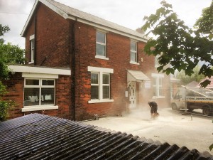 An image showing builders Blackpool working on a new driveway on a home