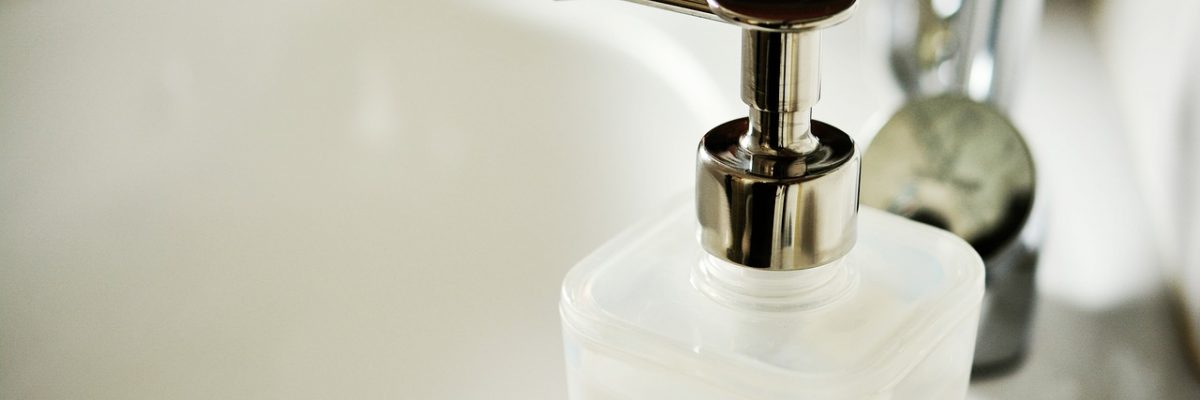 A picture of a bathroom soap dispenser