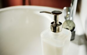 A picture of a bathroom soap dispenser