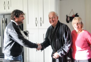 A picture showing a couple shaking hands with their Blackpool builder, their faces displaying great satisfaction with their full house renovation